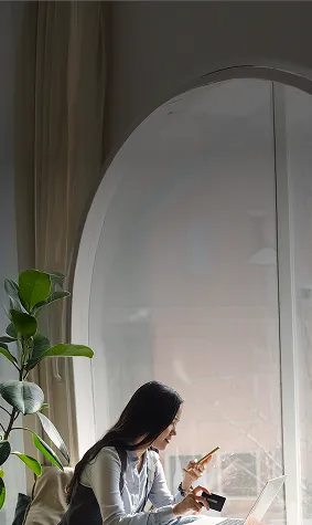 Woman comparing credit card offers on a laptop